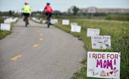 Photo: Signs along the route, one saying "I ride for Mom!"