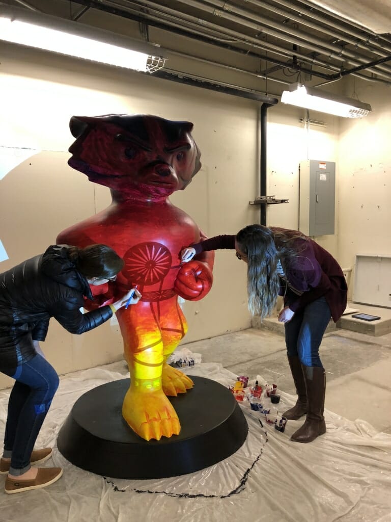 Allyson and Megan putting the final touches on Sunset Bucky.