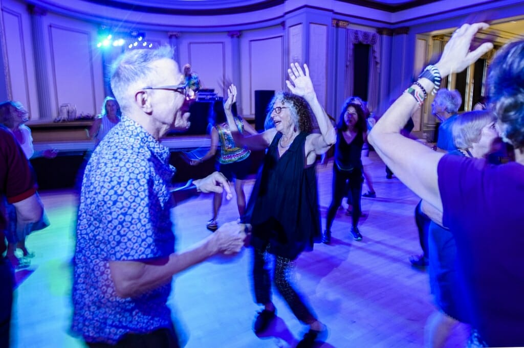 UW alums Andy Mirer (left) and Suzanne Korey (center) take to the dance floor during the Dance Party event in the Great Hall in the Memorial Union at the University of Wisconsin–Madison, which was part of the larger Madison Reunion that took place from June 14-17, 2018. 