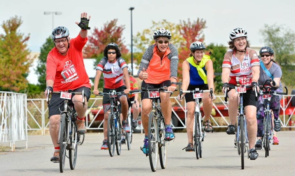 Photo: Six bicyclists crossing finish line