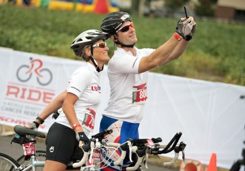 Photo: Two riders in helmets taking a selfie