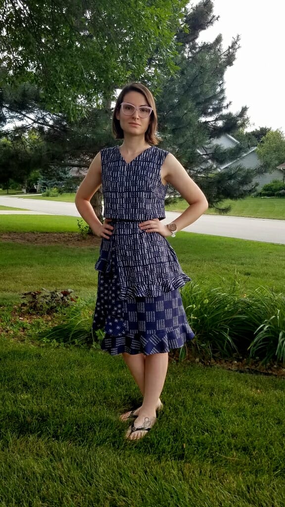 Sarah Friedland models one of her favorite garments she has designed, a blue, multi-patterned dress.