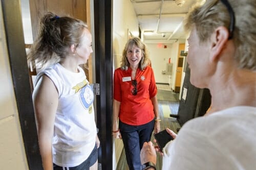 Photo: Reesor and Mangelsdorf standing in doorway with Abby