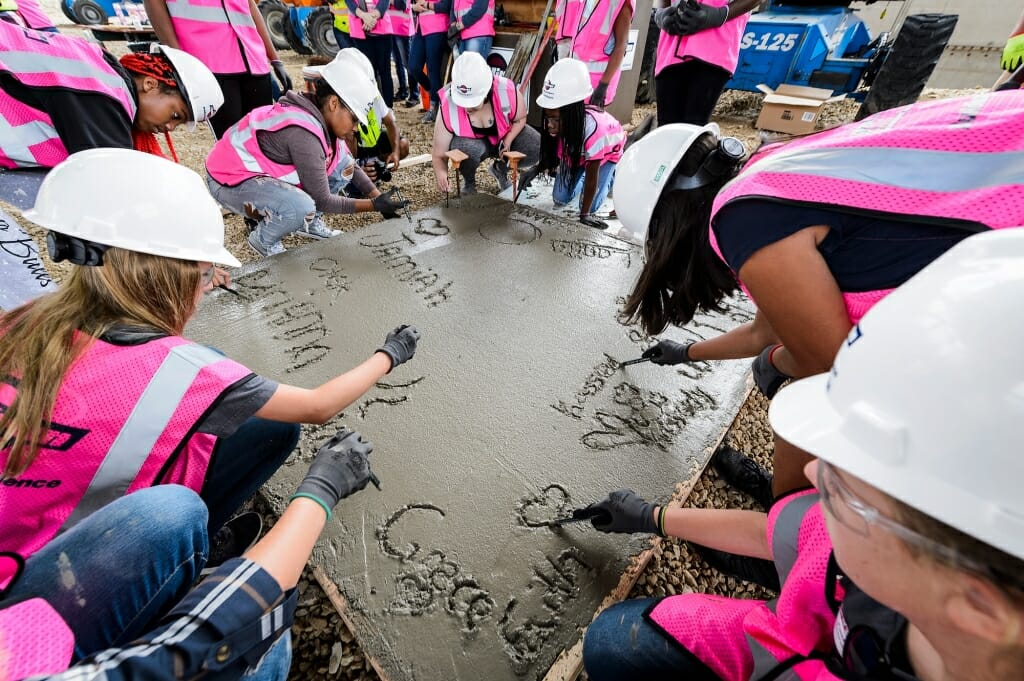 For a finishing touch, the girls sign their names.