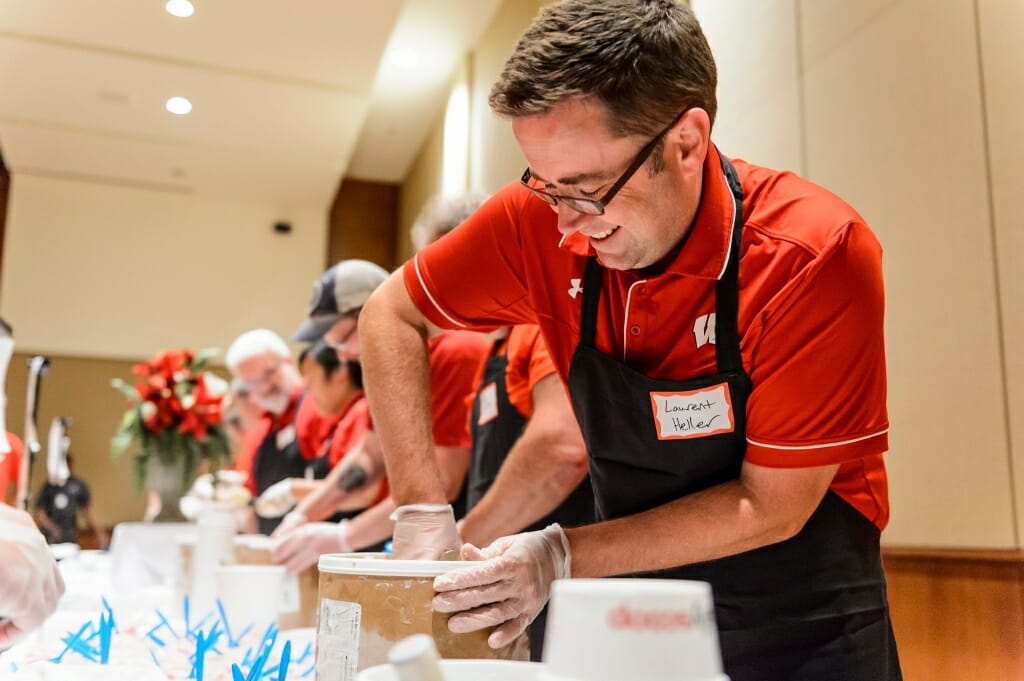 Photo: Laurent Heller reaching into a large ice cream carton