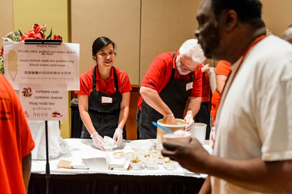 Photo: People behind a table with small dishes of ice cream