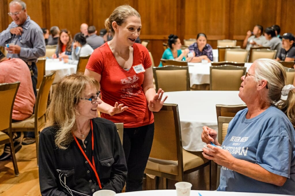 Photo: Jenn Hekman talking to people at table