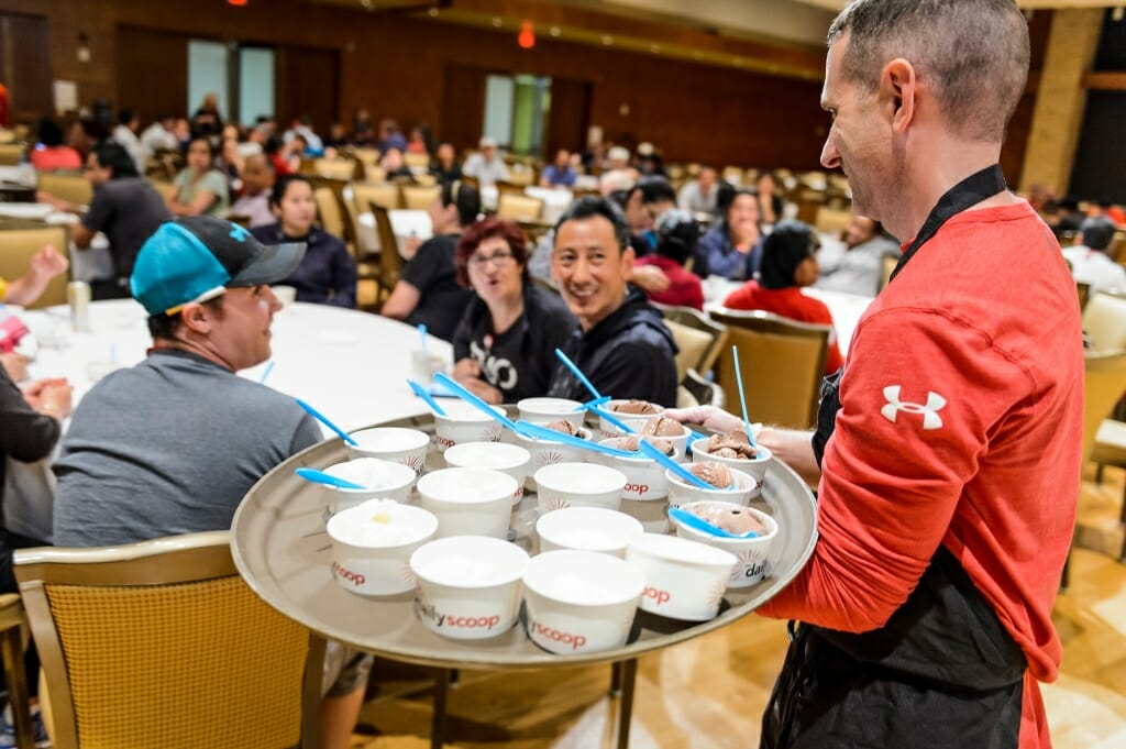 Photo: Jay Bieszke holding a tray with dishes of ice cream