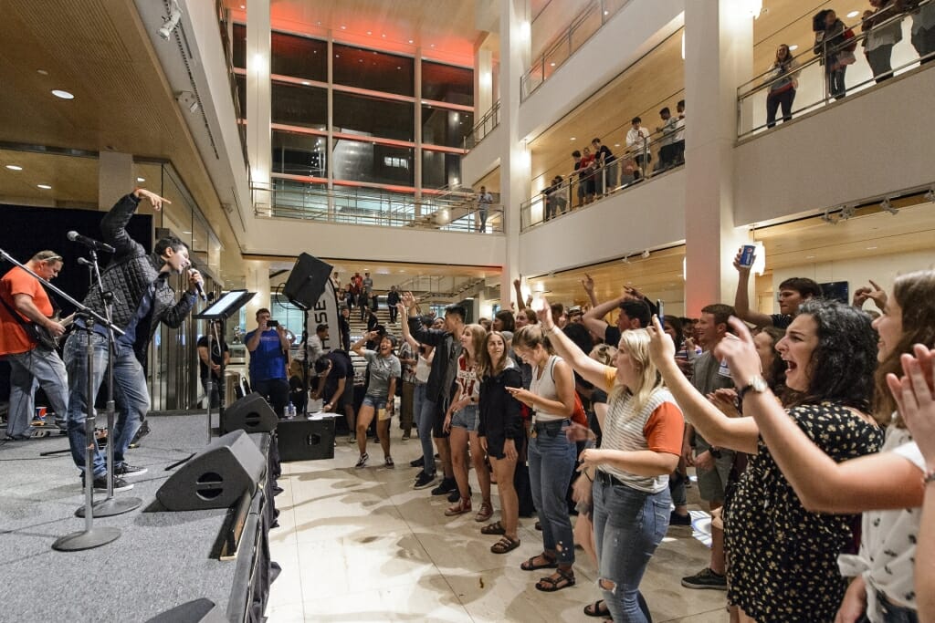 UW student Ryan Mahajan (left) brings out his inner rockstar as he sings 