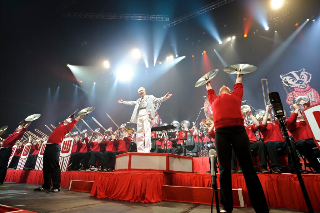 Photo: Leckrone conducting with band members behind him