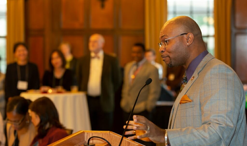 Patrick Sims gesticulates while speaking.