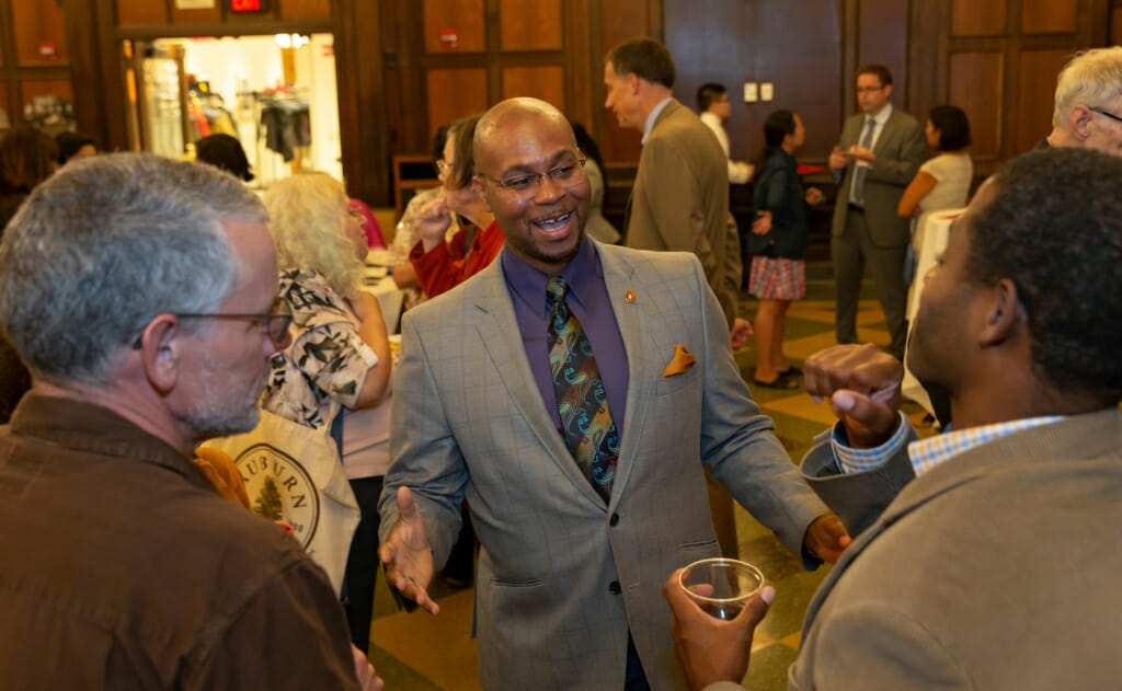 Patrick Sims greets people.