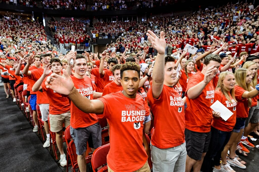 First-year students link arms and sing 