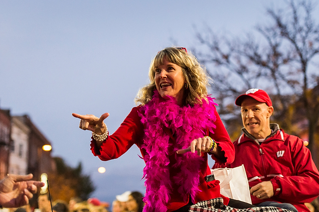 Lori Reesor, vice chancellor of student affairs, and Argyle Wade, interim Dean of Students, wave to the crowd at the Homecoming Parade.