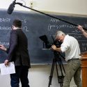 UW-Madison math professor Jordan Ellenberg works the numbers on quarterbacks Aaron Rodgers and Tom Brady, while NBC Sports films him.