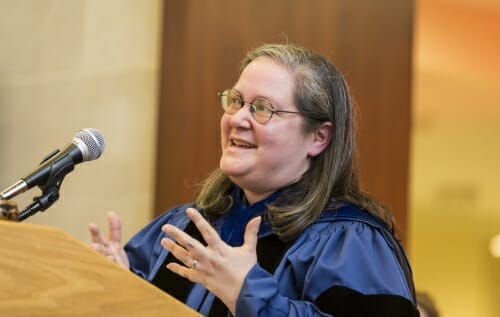 Photo of Marina Moskowitz, gesturing and talking.