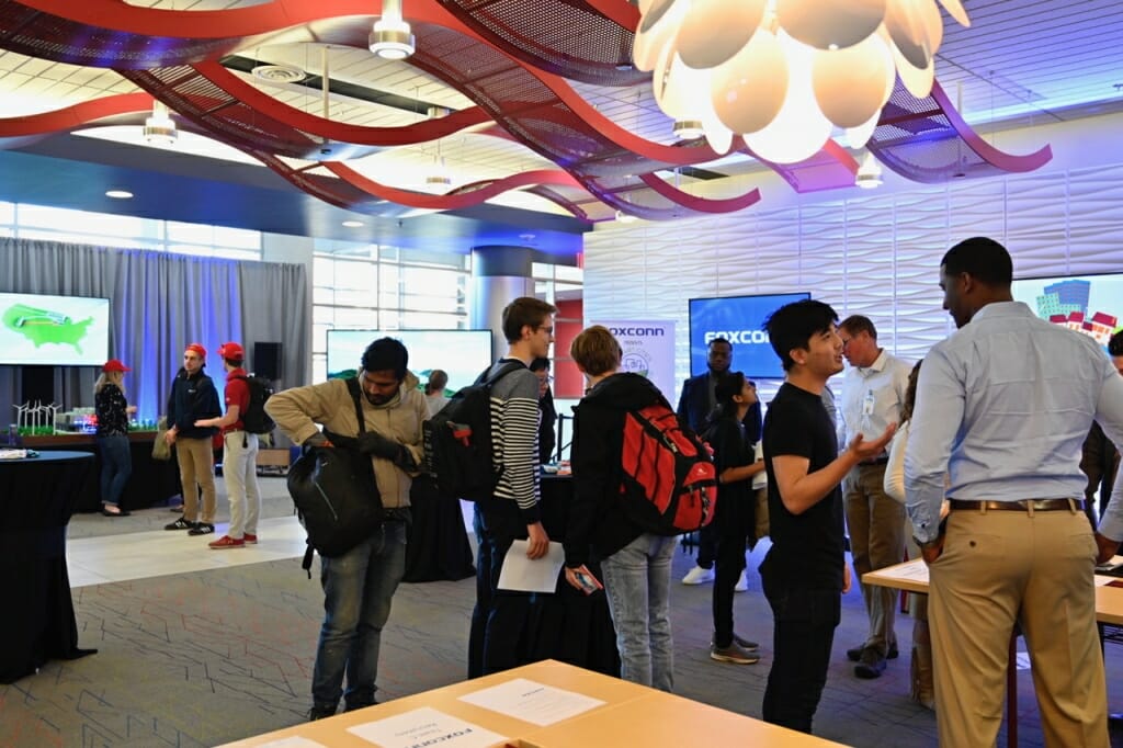 Students mingle in a high-tech hall.