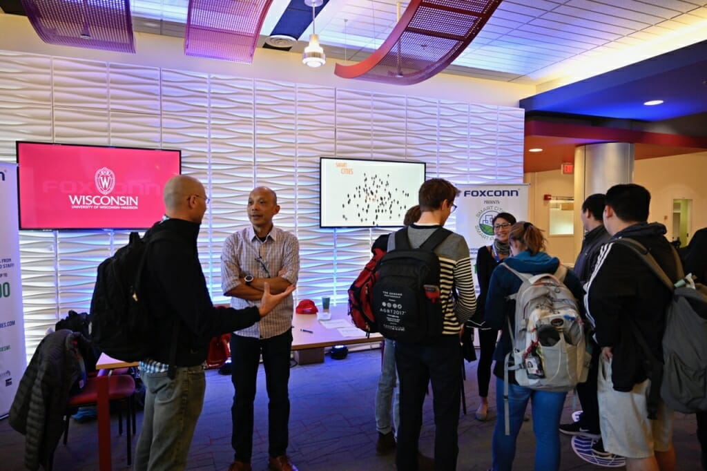 Students mingle in a high-tech hall