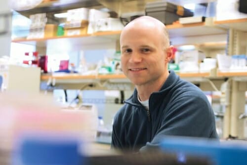 Photo: Bill Murphy seated in a lab