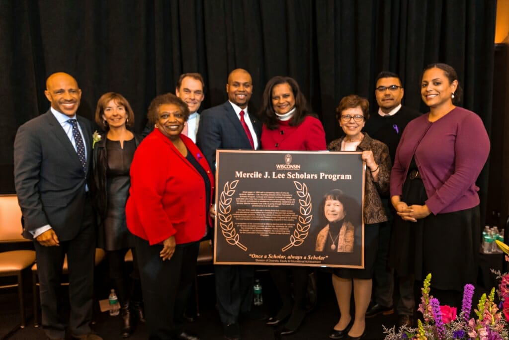 Photo: Dignitaries standing around plaque