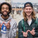 Photo of four students flashing the W hand sign.