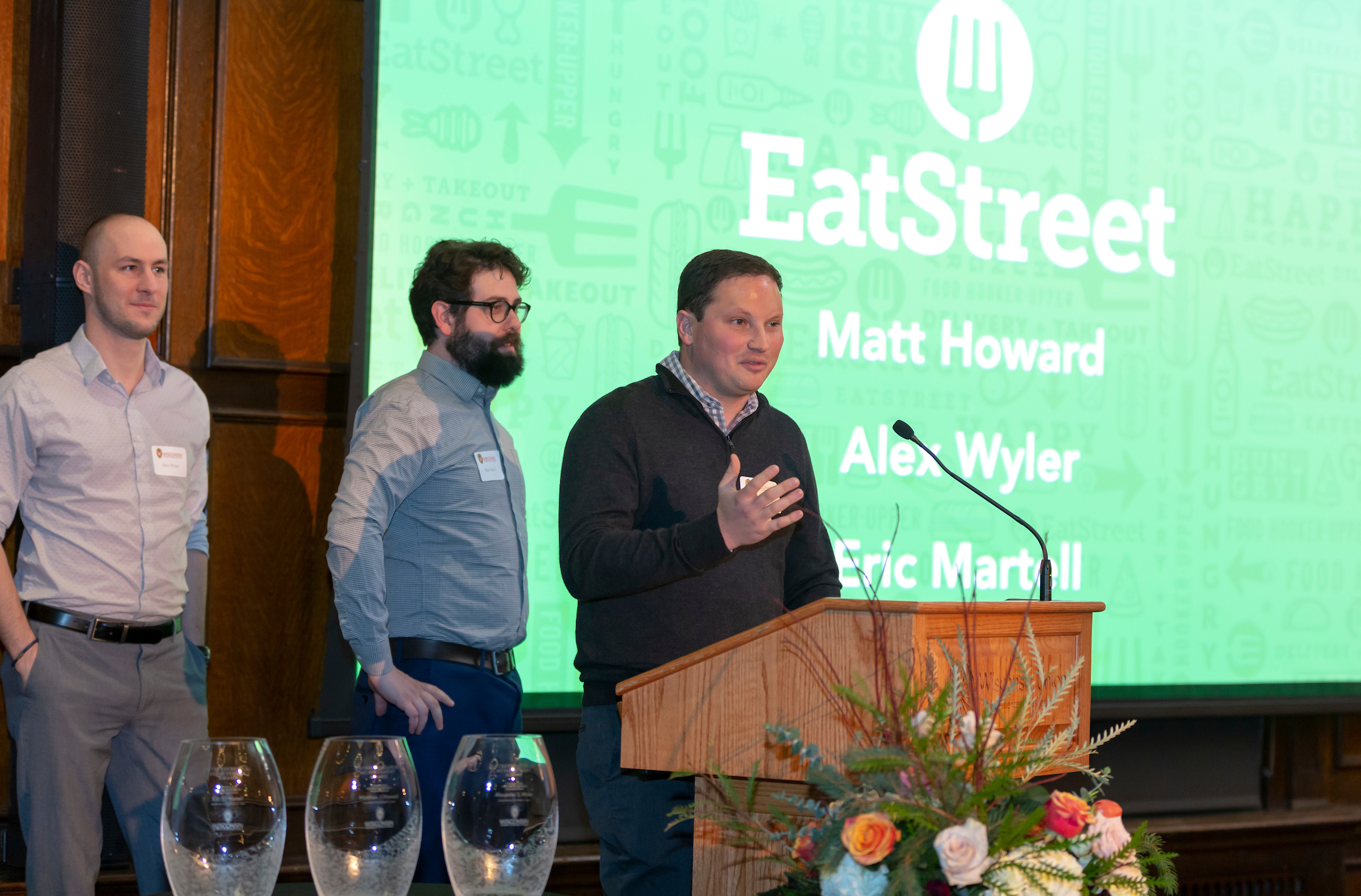 Photo of EatStreet CEO Matt Howard accepting the 2018 Entrepreneurial Achievement Awards on Nov. 14 with co-founders (from left) Alex Wyler and Eric Martell.