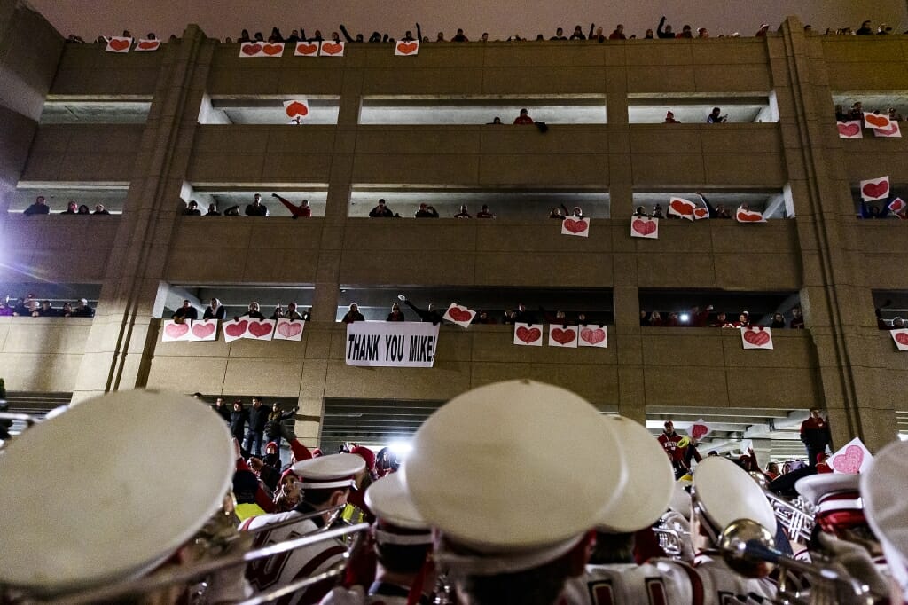 Fans show their appreciation for UW Band director Mike Leckrone outside Camp Randall Stadium following his final home football game.