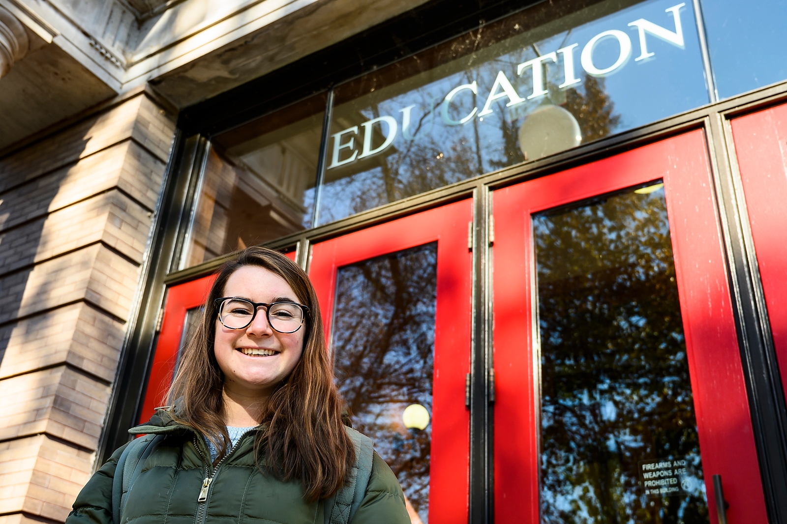 Photo of Mackenzie Straub in front of the Education Building.