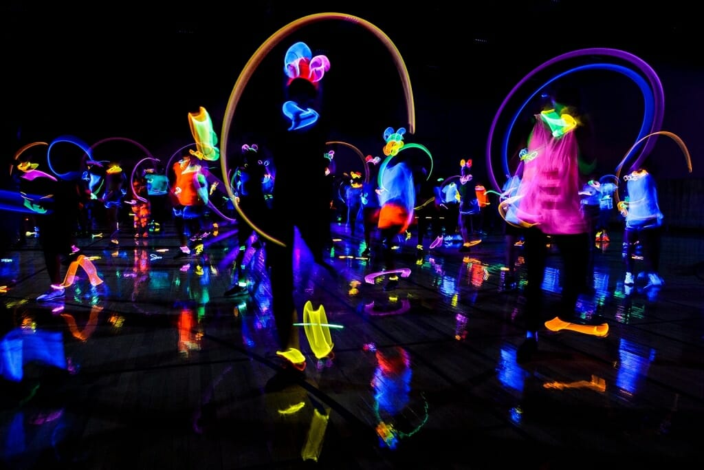 Photo: People working out in the dark in glowing clothing