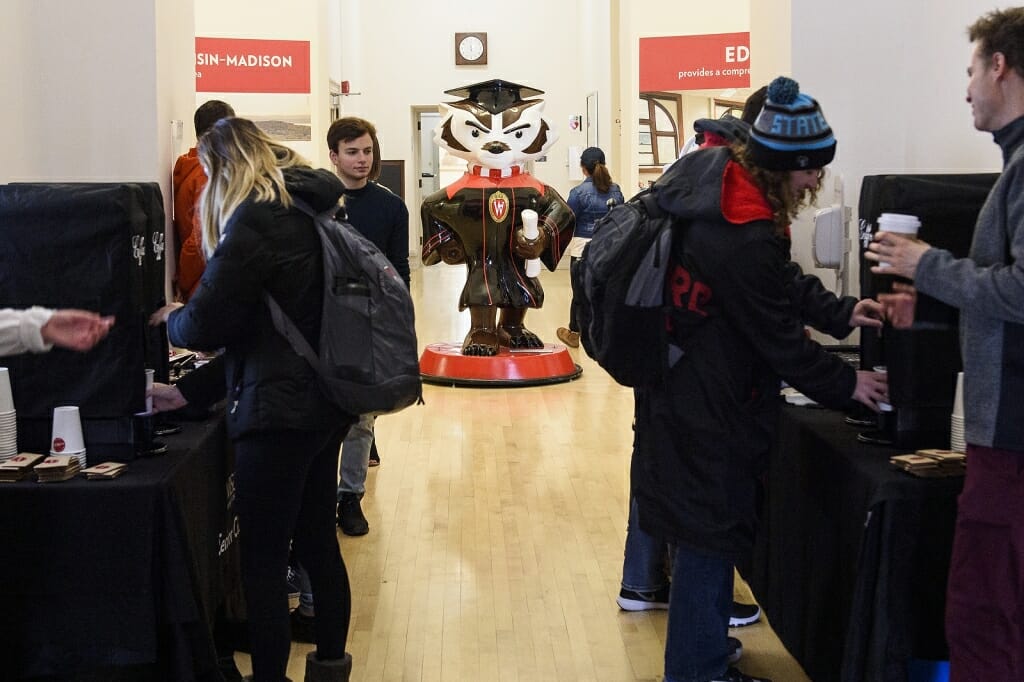 Photo: Students help themselves to free coffee and donuts.