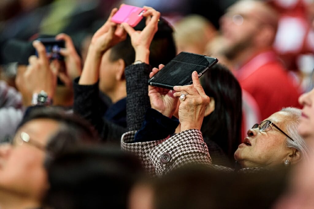 Photo of family members snapping photos.