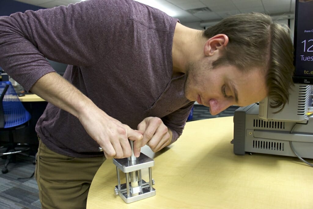 Photo: Student working on an instrument