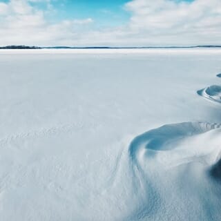 Photo: Snowdrifts along shoreline of Lake Mendota.