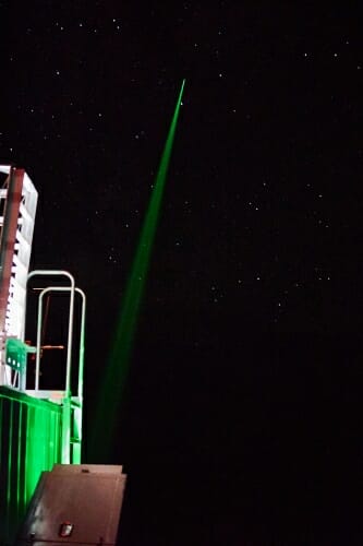 Photo: Time-exposure photo of laser beam aimed into space