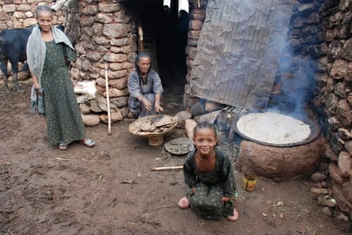 Photo: People gathered around a stove