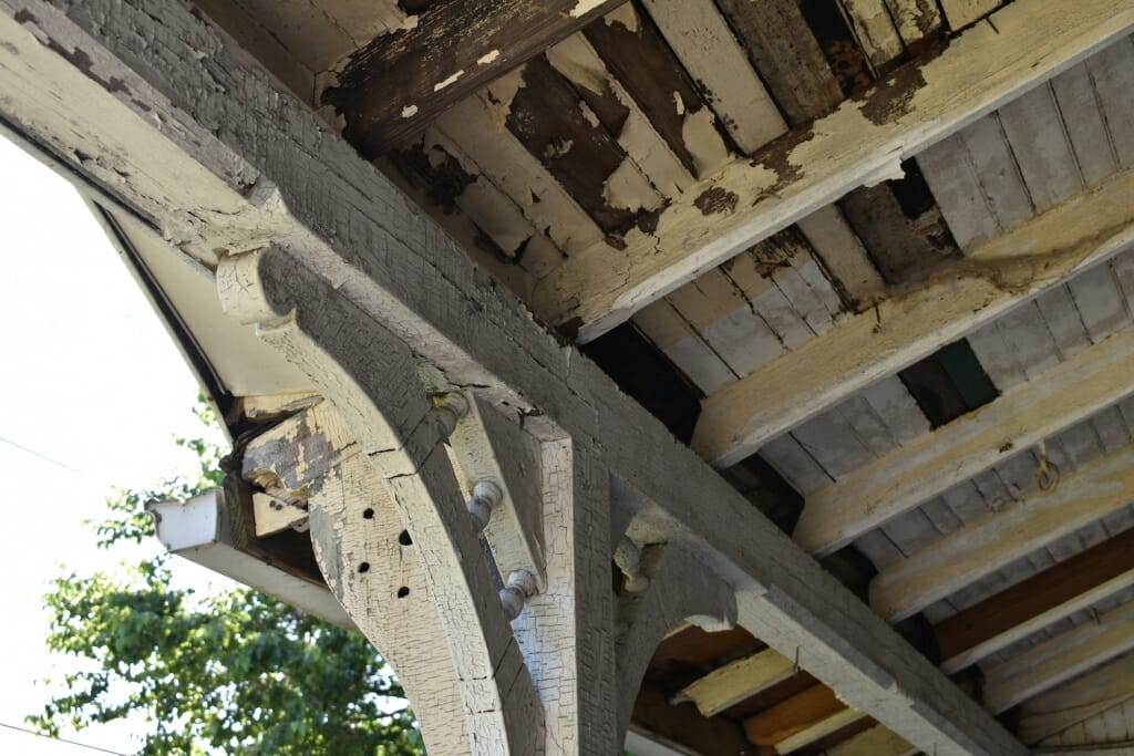 Photo: Peeling paint on a porch ceiling.