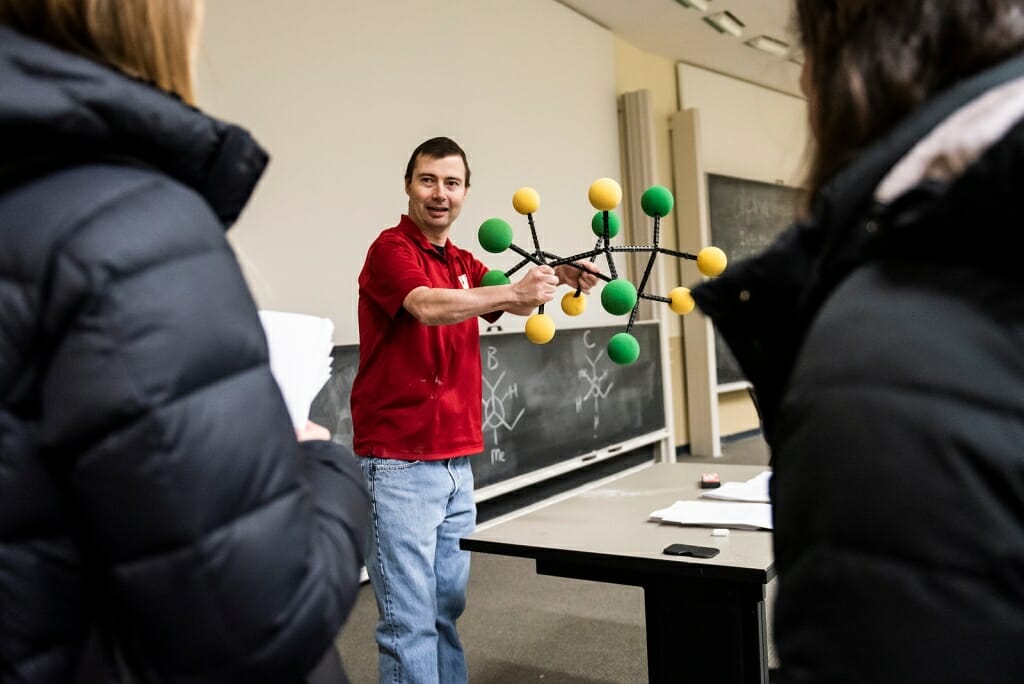 Photo: Matt holding model of a molecule