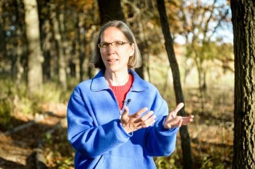 Photo: Oberhauser gesturing in front of trees