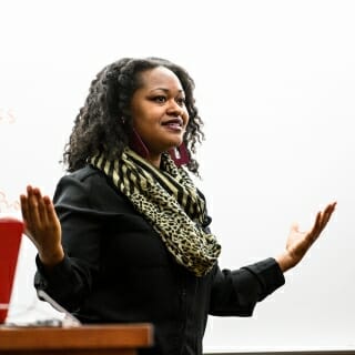 Photo: Bianca Baldridge standing and gesturing