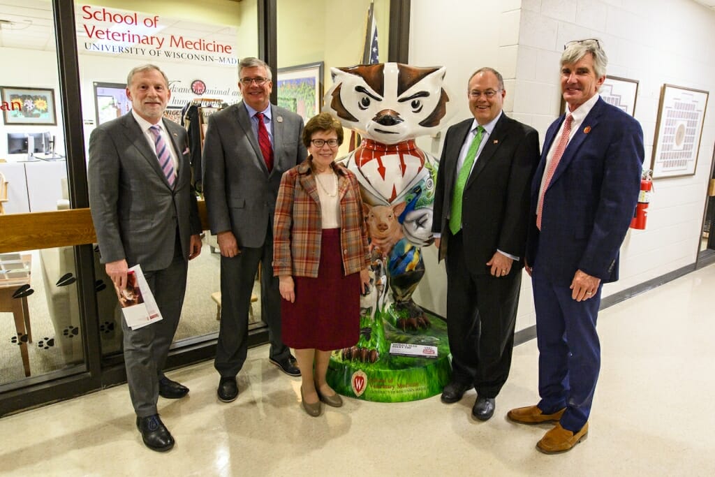 Photo: Group of people posed around Bucky Badger.