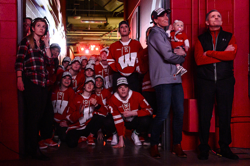 Photo of players watching a video before taking the stage.