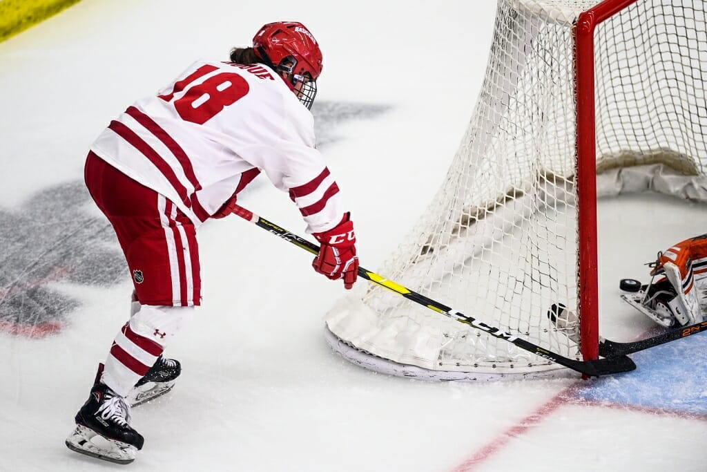 Roque (18) scores as she sneaks the puck into the corner of the net.