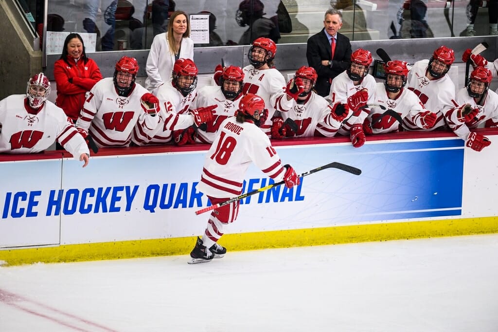 Roque (18) celebrates a goal with her teammates.