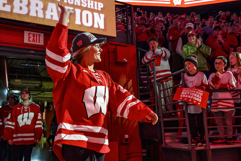 Photo of forward Emily Clark waving to the crowd.