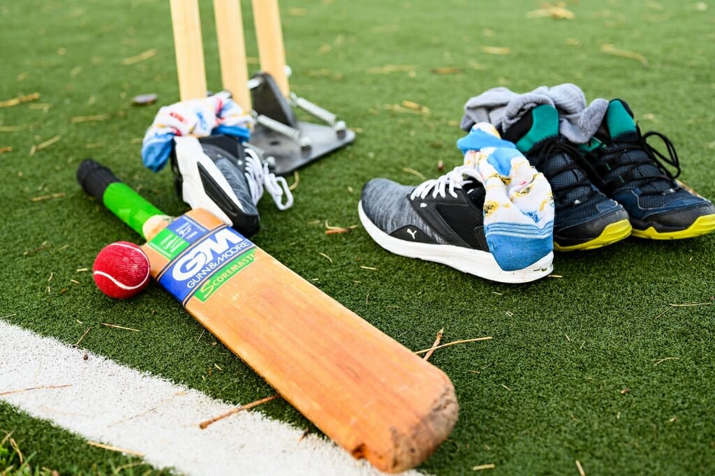 Photo: A bat and some shoes on the turf