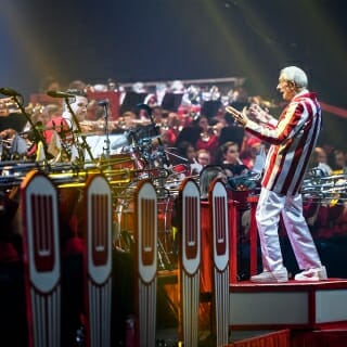 Photo; Leckrone gestures to his musicians.