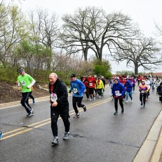 Photo: Runners struggle up a steep hill.