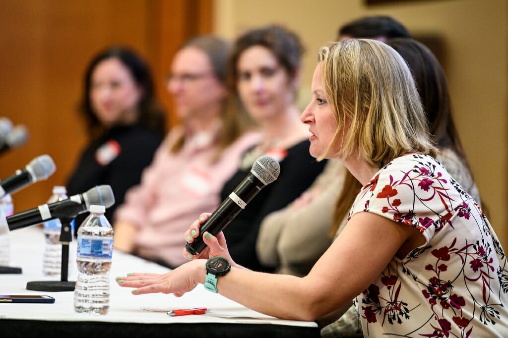 Photo: Kari speaking into microphone