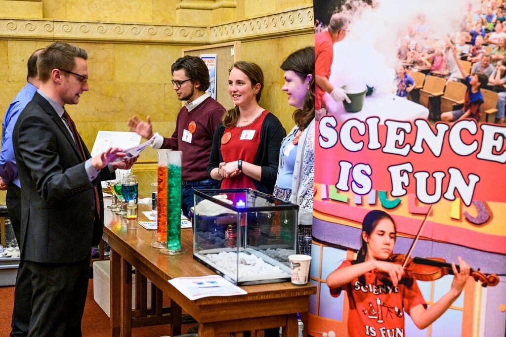 Photo: Students standing next to Science is Fun sign