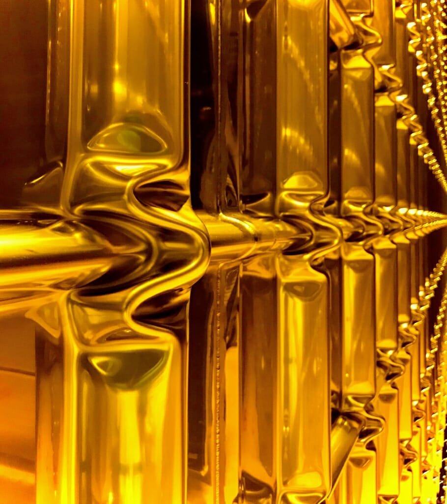 Photo: the corrugated steel wall of a vessel that will hold 135,000 gallons of liquid argon at minus 235 degrees Fahrenheit in a pilot neutrino detection project